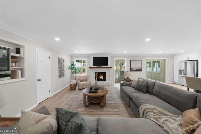 7300 Wynhill Dr, Sandy Springs, GA 30328 - living room with recessed lighting, crown molding, and plenty of natural light
