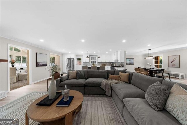 7300 Wynhill Dr, Sandy Springs, GA 30328 - living room featuring plenty of natural light, light wood-style flooring, baseboards, and recessed lighting