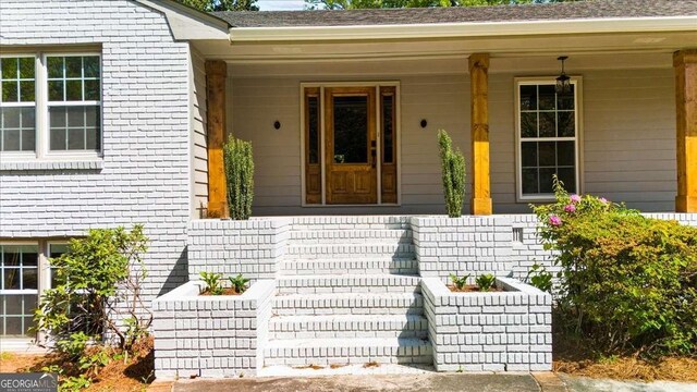 7300 Wynhill Dr, Sandy Springs, GA 30328 - property entrance with brick siding and covered porch