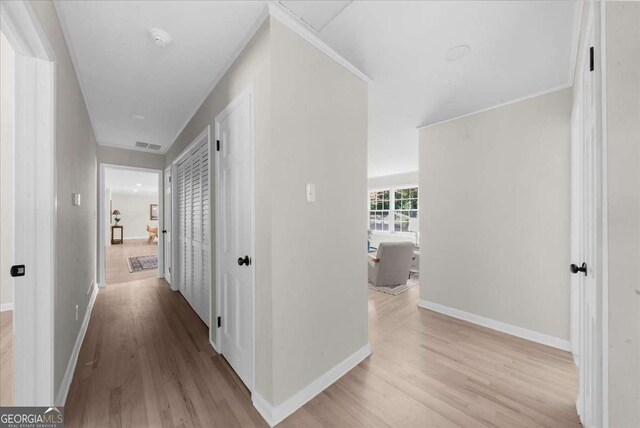 7300 Wynhill Dr, Sandy Springs, GA 30328 - hall featuring baseboards, visible vents, and light wood finished floors