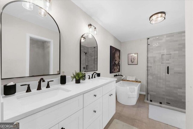 7300 Wynhill Dr, Sandy Springs, GA 30328 - bathroom featuring a freestanding bath, a stall shower, and a sink