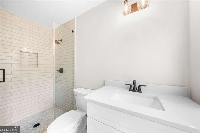 7300 Wynhill Dr, Sandy Springs, GA 30328 - full bathroom with vanity, a shower stall, and toilet