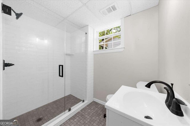 7300 Wynhill Dr, Sandy Springs, GA 30328 - full bath featuring a shower stall, baseboards, tile patterned floors, and visible vents