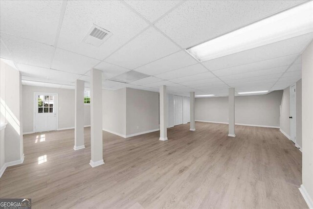 7300 Wynhill Dr, Sandy Springs, GA 30328 - basement featuring light wood finished floors and a paneled ceiling