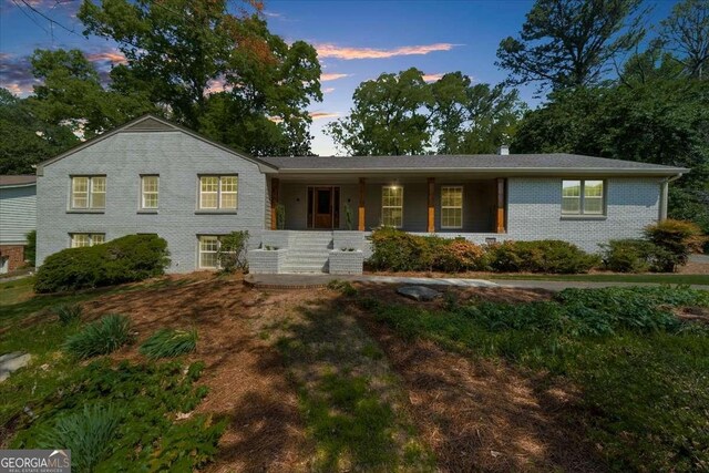 7300 Wynhill Dr, Sandy Springs, GA 30328 - view of front of house with covered porch and brick siding