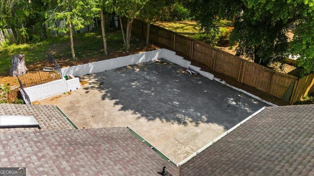 7300 Wynhill Dr, Sandy Springs, GA 30328 - details with a shingled roof and a fenced backyard