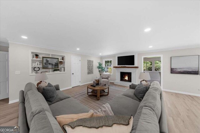7300 Wynhill Dr, Sandy Springs, GA 30328 - living area featuring wood finished floors, baseboards, and crown molding