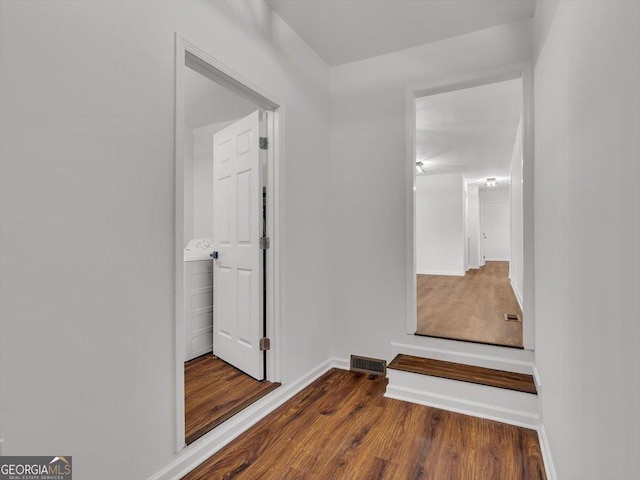 110 Dorsey St, Calhoun, GA 30701 - hall with baseboards, visible vents, and wood finished floors