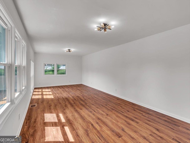 110 Dorsey St, Calhoun, GA 30701 - empty room featuring baseboards, visible vents, and dark wood finished floors