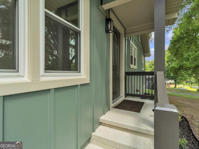 110 Dorsey St, Calhoun, GA 30701 - exterior space featuring covered porch and board and batten siding