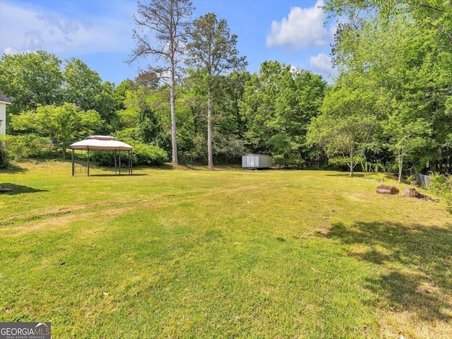 110 Dorsey St, Calhoun, GA 30701 - view of yard featuring an outdoor structure, a gazebo, and a shed