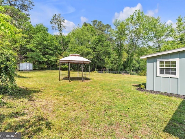 110 Dorsey St, Calhoun, GA 30701 - view of yard featuring a storage unit, a gazebo, and an outbuilding