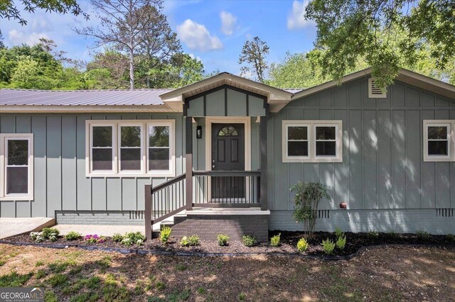 110 Dorsey St, Calhoun, GA 30701 - manufactured / mobile home with board and batten siding, metal roof, and crawl space