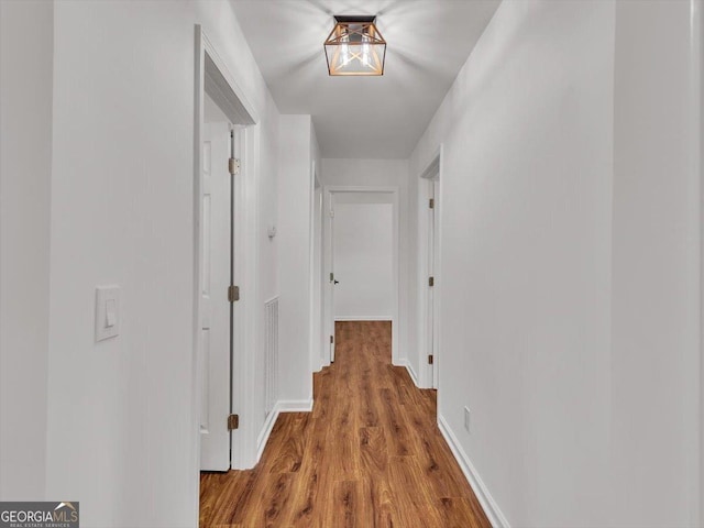 110 Dorsey St, Calhoun, GA 30701 - hall with baseboards and wood finished floors