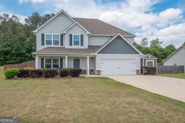craftsman inspired home with fence, a shingled roof, driveway, covered porch, and a garage