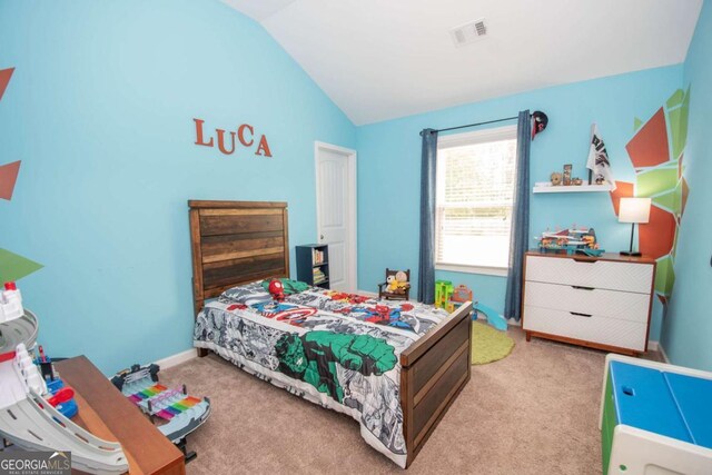 bedroom featuring lofted ceiling, visible vents, baseboards, and carpet