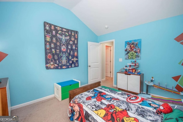 carpeted bedroom featuring vaulted ceiling and baseboards