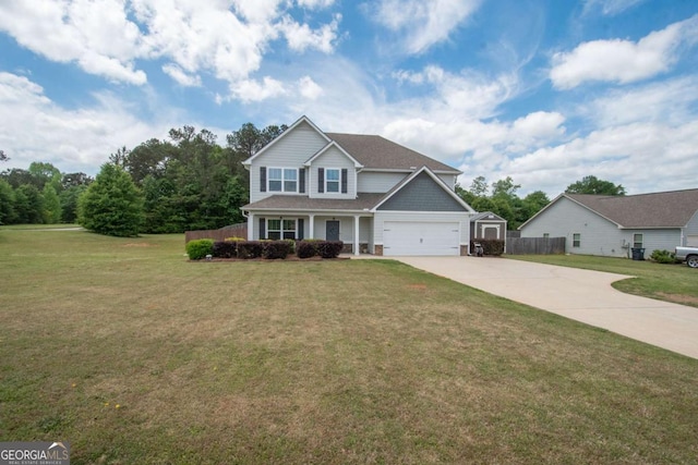 traditional-style house featuring fence, a front lawn, a garage, and concrete driveway