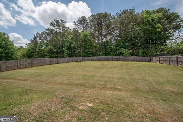 view of yard featuring a fenced backyard