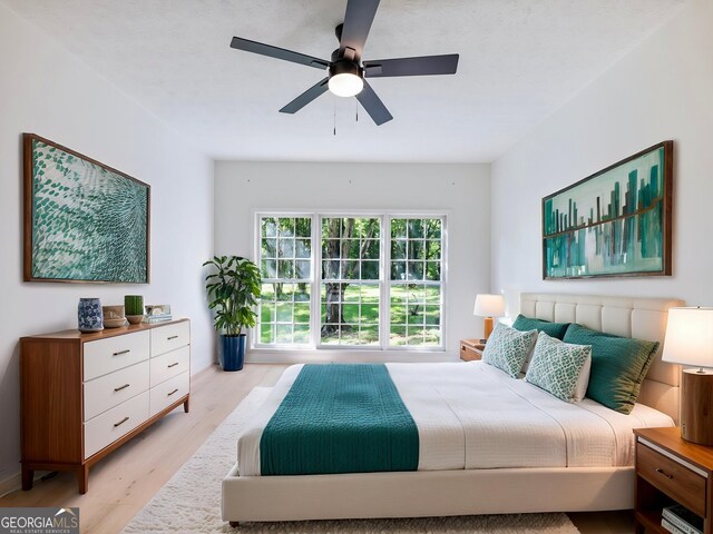 bedroom with wood finished floors and ceiling fan