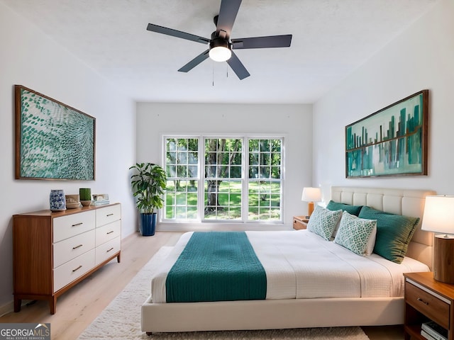 6212 Germantown Dr, Flowery Branch, GA 30542 - bedroom with wood finished floors and a ceiling fan