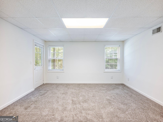 6212 Germantown Dr, Flowery Branch, GA 30542 - carpeted empty room with healthy amount of natural light and a drop ceiling