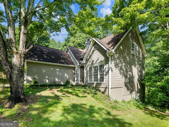 back of house featuring a yard