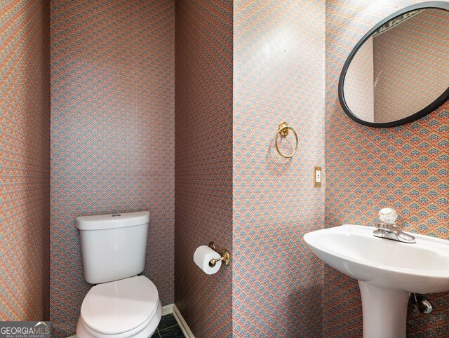 half bath featuring toilet