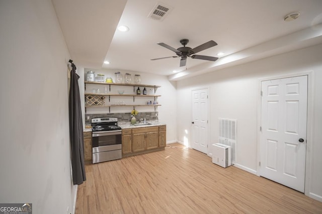2019 Chelton Way SE, Smyrna, GA 30080 - kitchen featuring stainless steel range with electric cooktop, open shelves, recessed lighting, a sink, and light wood-style floors