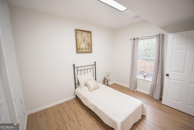 2019 Chelton Way SE, Smyrna, GA 30080 - bedroom featuring light wood-style flooring and baseboards