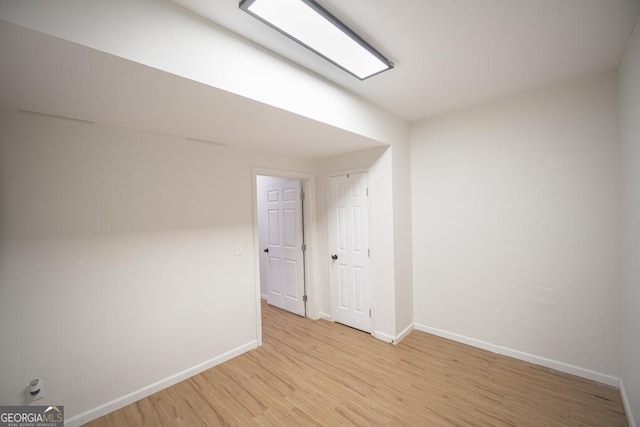 2019 Chelton Way SE, Smyrna, GA 30080 - spare room with light wood-style floors and baseboards