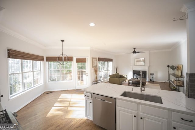 2019 Chelton Way SE, Smyrna, GA 30080 - kitchen with stainless steel dishwasher, a sink, white cabinetry, ornamental molding, and healthy amount of natural light