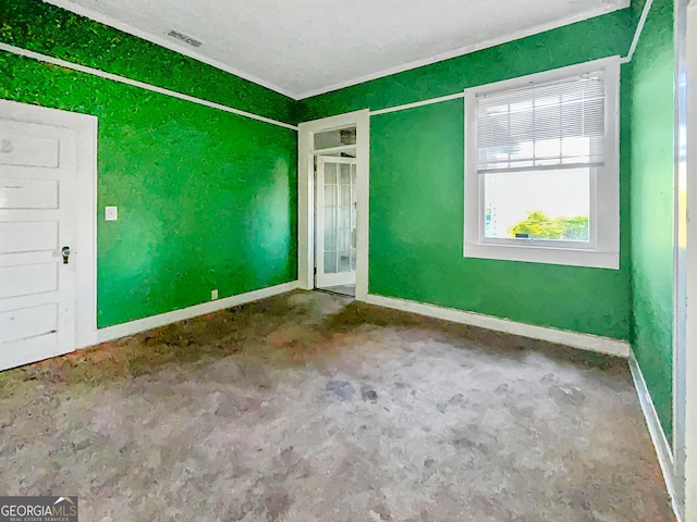 empty room with visible vents and baseboards