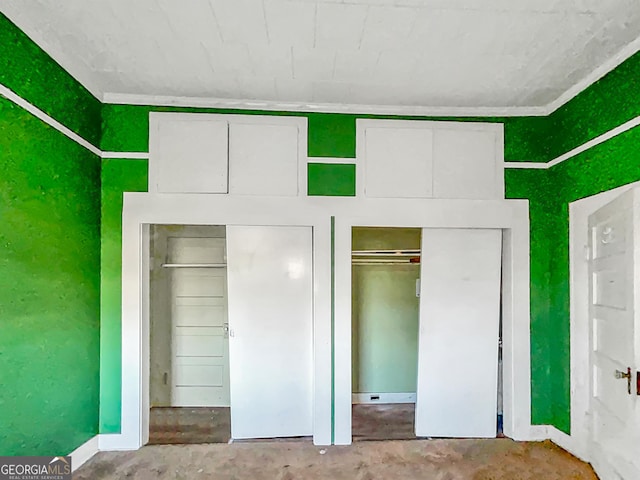 unfurnished bedroom featuring concrete flooring