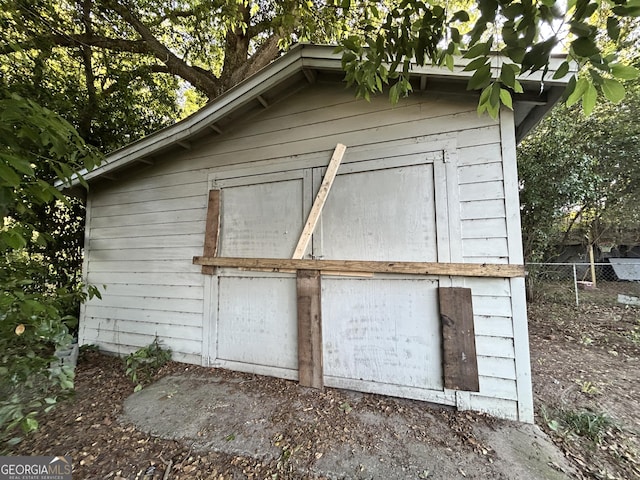 view of shed with fence