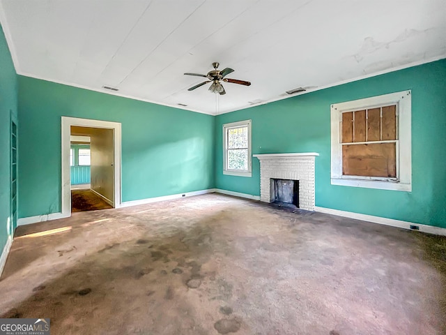 unfurnished living room with baseboards, a healthy amount of sunlight, and carpet flooring
