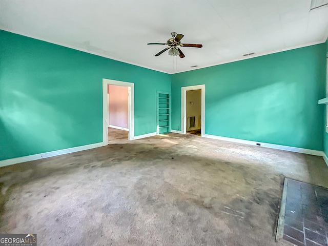 unfurnished bedroom featuring visible vents, carpet flooring, baseboards, and a ceiling fan