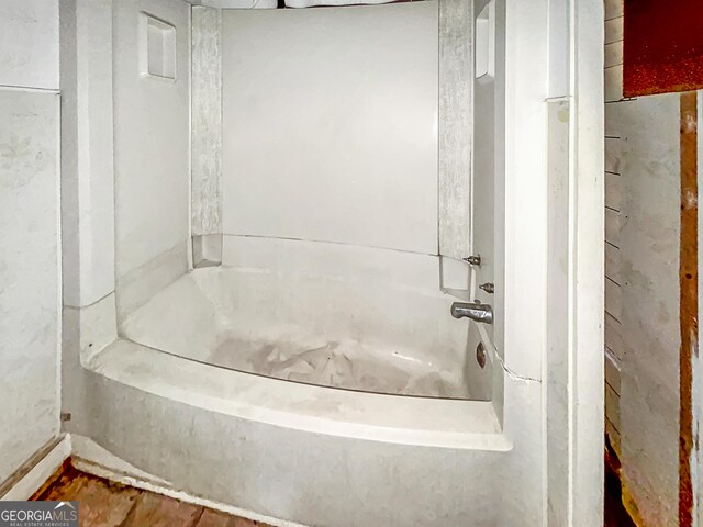 full bath with a bath