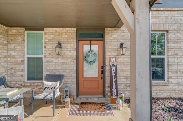 59 Michigan Cir, Hoschton, GA 30548 - carpeted living room featuring baseboards, a towering ceiling, visible vents, and a fireplace
