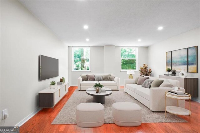2965 Pharr Ct S Unit 110, Atlanta, GA 30305 - living room featuring recessed lighting, wood finished floors, and baseboards