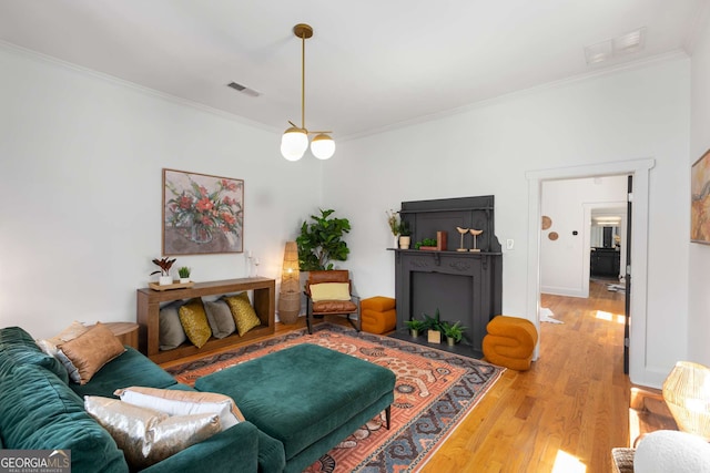 69 Hogue St NE, Atlanta, GA 30312 - living area featuring ornamental molding and light wood-style flooring