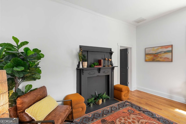 69 Hogue St NE, Atlanta, GA 30312 - living area featuring wood finished floors, crown molding, and baseboards