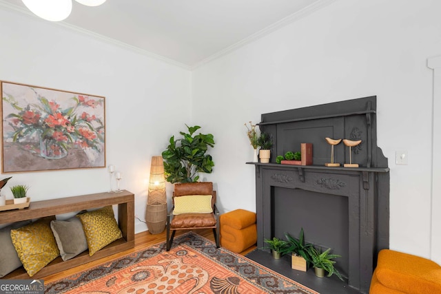 69 Hogue St NE, Atlanta, GA 30312 - living area with ornamental molding, a fireplace, and wood finished floors