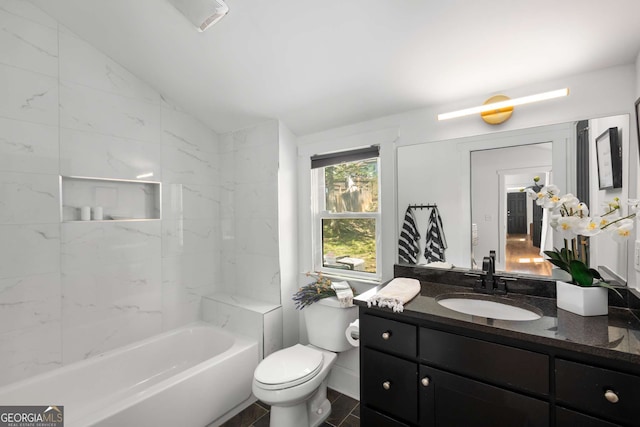 69 Hogue St NE, Atlanta, GA 30312 - full bathroom with vaulted ceiling, vanity, toilet, and  shower combination