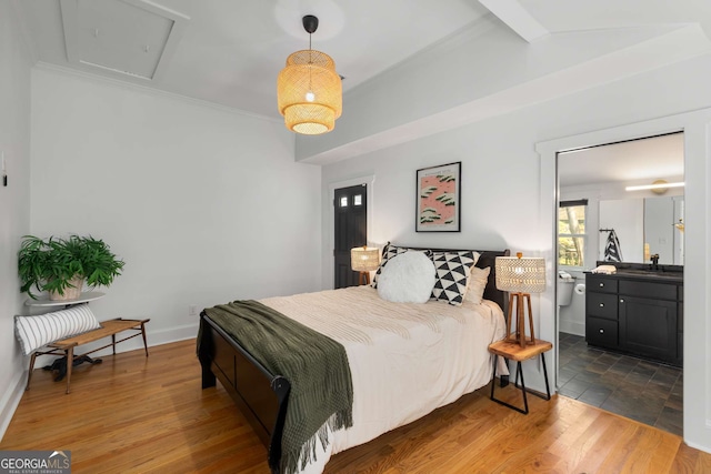 69 Hogue St NE, Atlanta, GA 30312 - bedroom featuring a sink, beam ceiling, wood finished floors, baseboards, and ornamental molding
