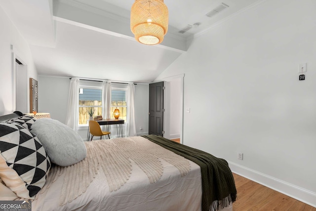 69 Hogue St NE, Atlanta, GA 30312 - bedroom with light wood-type flooring, baseboards, lofted ceiling, and ornamental molding