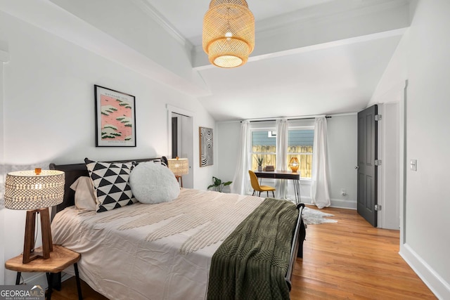 69 Hogue St NE, Atlanta, GA 30312 - bedroom featuring light wood-type flooring, baseboards, ornamental molding, and vaulted ceiling