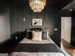 69 Hogue St NE, Atlanta, GA 30312 - bedroom with a chandelier and wood finished floors