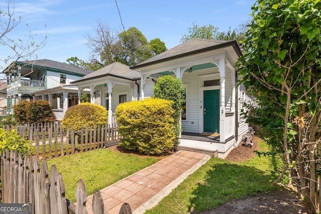 69 Hogue St NE, Atlanta, GA 30312 - shotgun-style home featuring a porch and roof with shingles