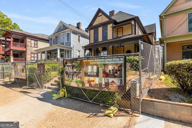 69 Hogue St NE, Atlanta, GA 30312 - victorian house featuring a gate and a chimney